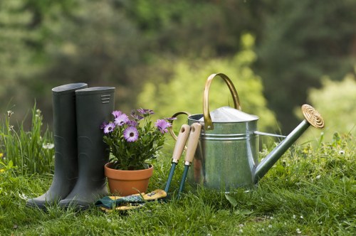Professional gardener in a Brompton garden preparing tools