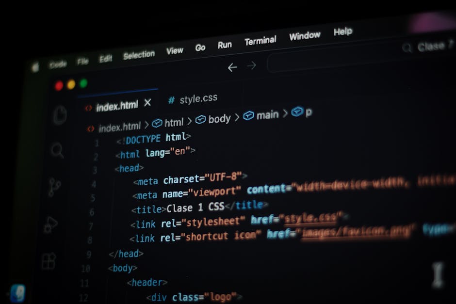 A computer screen displaying HTML code with visible tags such as <html>, <head>, <title>, and <link>, featuring a dark background with syntax highlighting in various colors including blue, orange, and